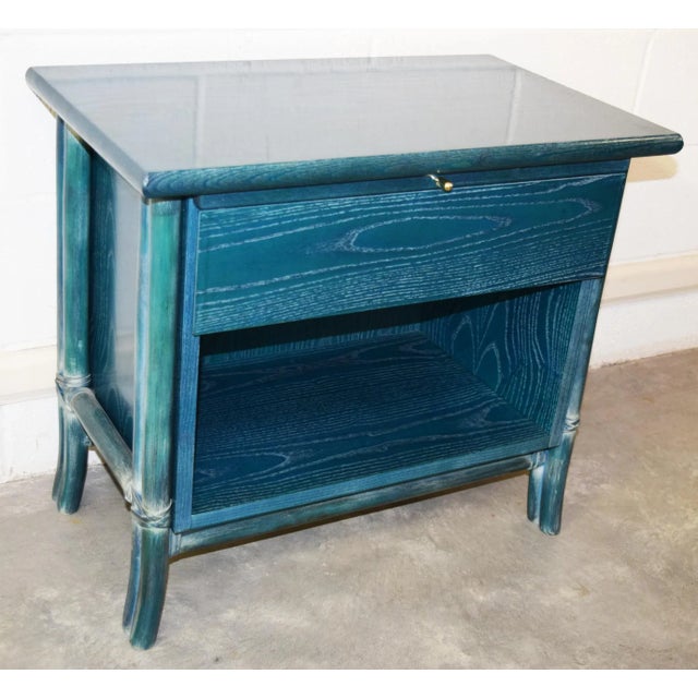 - Pair of bedside tables in ash veneered wood with open pore lacquered Mannao cane supports - Each bedside table has a...