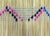 A fine and well-used handwoven square mat made out of straws and decorated with embroidered motifs and openwork patterns....