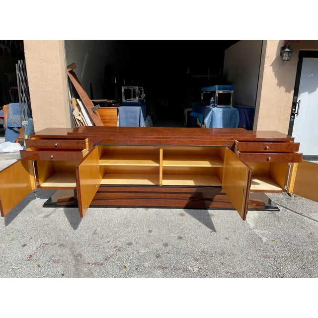 spectacular Classic 118.25 feet long French art deco Burlwood sideboard / buffet circa 1940s The sideboard has been...