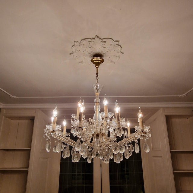 An impressive large-scale French crystal chandelier dating from circa 1930, featuring a generous and well-balanced form...