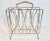 A stunning vintage mid century modern brass magazine rack. This is a sturdy piece with lots of room for storage.