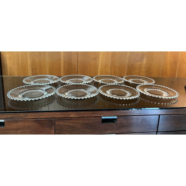 Set of eight Imperial Glass “Candlewick” plates. Candlewick is a highly collectible line of elegant glass that was...