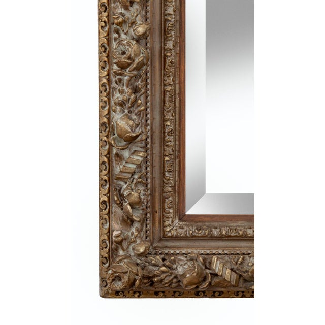 Floral framed beveled mirror with a gesso application over hardwood. new mirrored glass with small bevel. Beautiful frame...