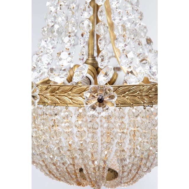 It looks to be of excellent quality. The brass and crystals are perfect. It uses three E27 bulbs. European Plug (up to...