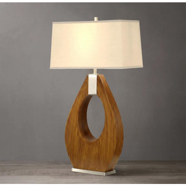 Elevate your favorite corner in the room to new heights of style with the mid-century modern Pearson Table Lamp....