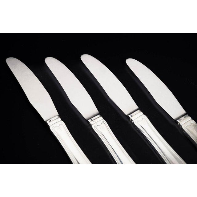 Georg Jensen, set of four lunch knives Old Danish. Set of four lunch knives in stainless steel and sterling silver with...