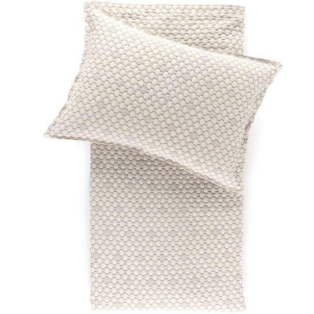 With its tempting texture and sensuous feel, the Lodi matelassé coverlet is perfect to layer into the Luxe Silver...