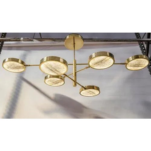 Unique chandelier, made from thinly-cut pieces of exquisite ivory-toned translucent onyx. Ideal to be hung over a table,...