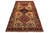 This Persian Shiraz hand-knotted wool rug back from the 1940s has a brown field with a multicolor geometric design. This...