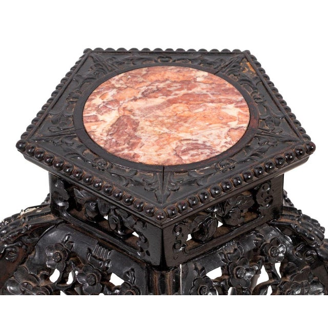 Chinese Carved Hardwood and Marble Pedestal, late 19th century, the pentagonal shaped inset top above a foliate carved...