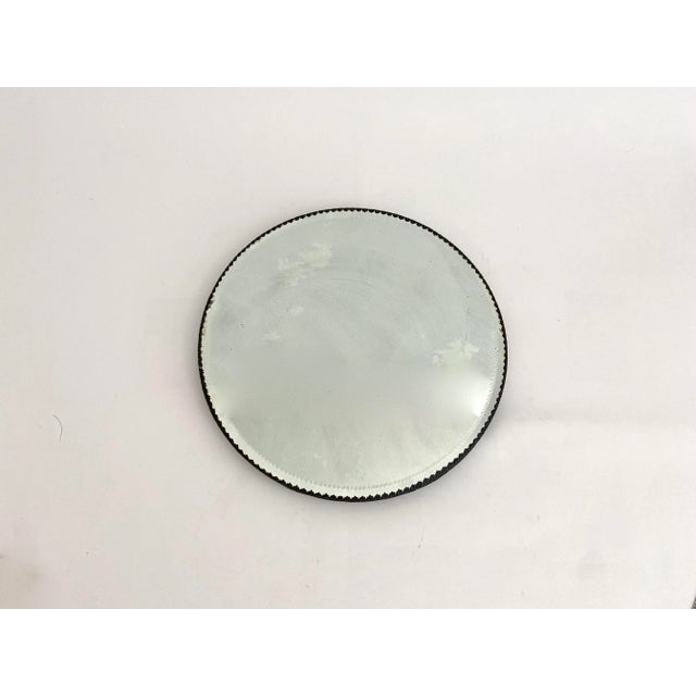 1930s beveled mirror plateau with detailed silver base commonly used to display vanity items. Age has left most of these...