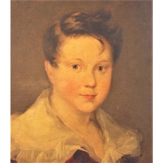 An antique English oil painting of a young boy. Painting is oil on canvas and without a frame. Very soft and pleasant...