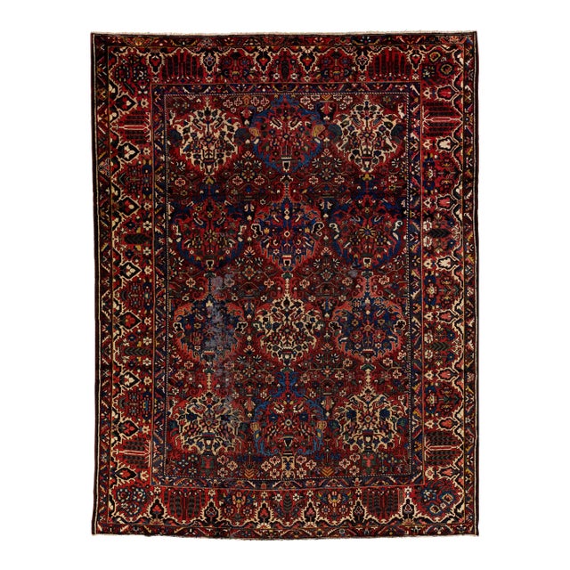 Handmade Antique Bakhtiari Persian Floral Wool Rug in Rust For Sale