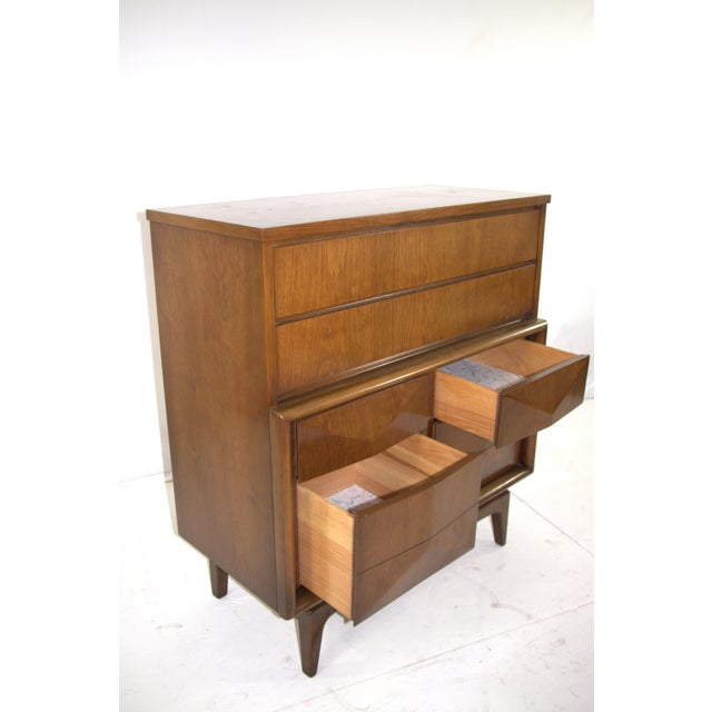 Featuring their iconic diamond shaped drawers and warm walnut grain. Six total drawers for bedroom storage. Each bottom...