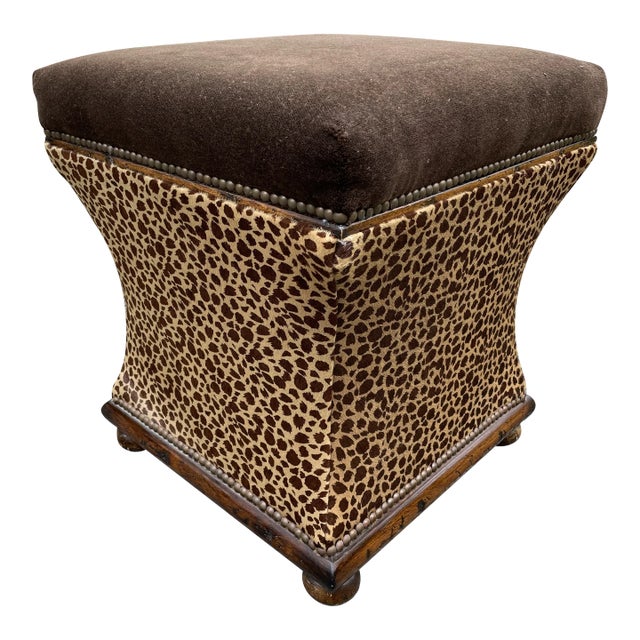 This is a handsome pair of animal print ottomans with wood bases and bun feet. They are upholstered in a deep chocolate...