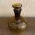 Very cool Mid Century brown, with hints of yellow, wine or liquor decanter. It's a great piece and will be the life of the...