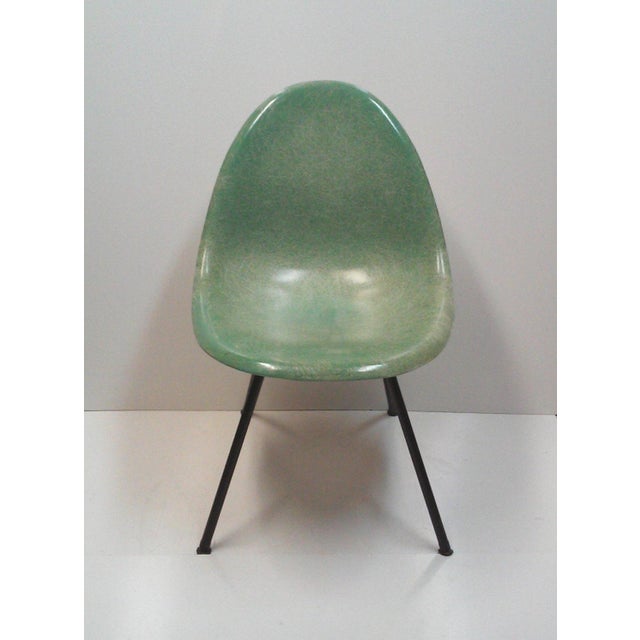 An early Mid-Century Herman Miller for Zenith style green fiberglass shell scoop chair considered to be the pre-cursor to...