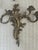 Elegant vintage French Rococo Revival style brass candelabra wall sconces with beautifully scrolling foliate details in...