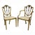 Comprising a pair of armchairs and 10 side chairs, each with a shield back and caned seats {all newly hand caned] raised...