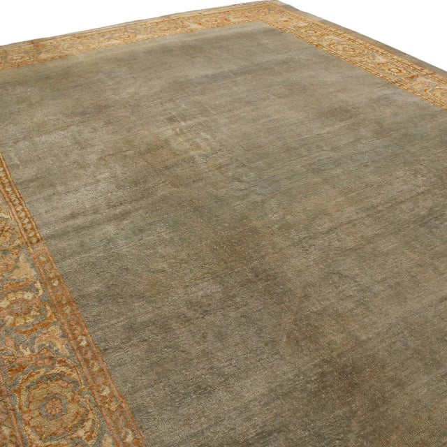 Hand knotted in high-quality wool originating from Persia in 1880, this antique Sultanabad Persian rug sports both...