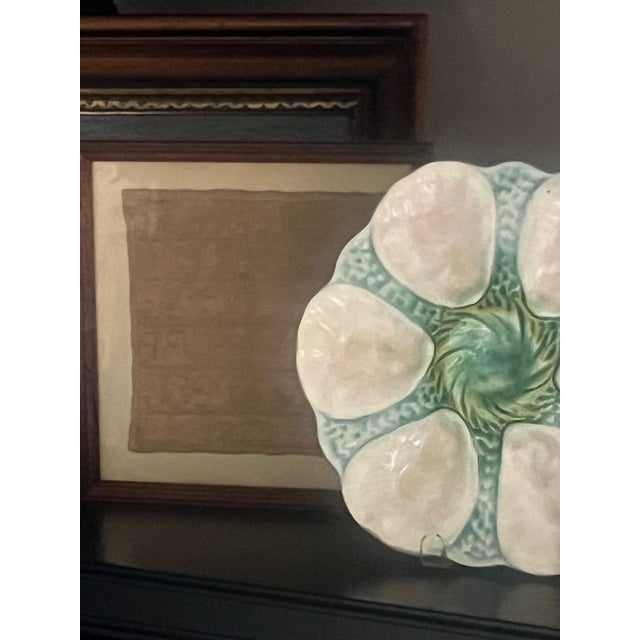 A unique beige on beige alphabet cross stitch crafted in 1820. Framed in a simple wooden frame, the fabric itself measures...