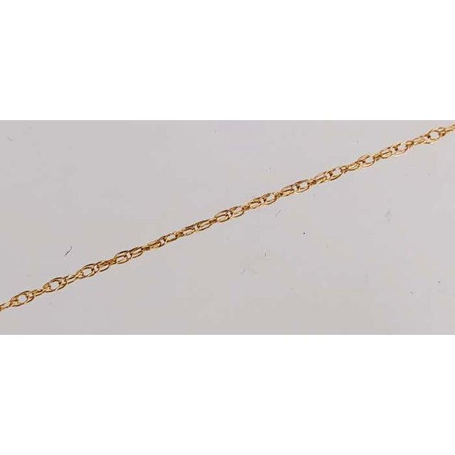 14Kt Yellow Gold 20 Inch Necklace with Diamond Encrusted Pendant 0.25 Total Diamond Weight 4.47 grams total weight.