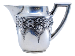 Silver Teapot with Raised Floral Motifs and Straight Handle