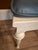This vintage cane and wood vanity chair is a timeless piece of functional art. Featuring intricate, hand-woven caning and...