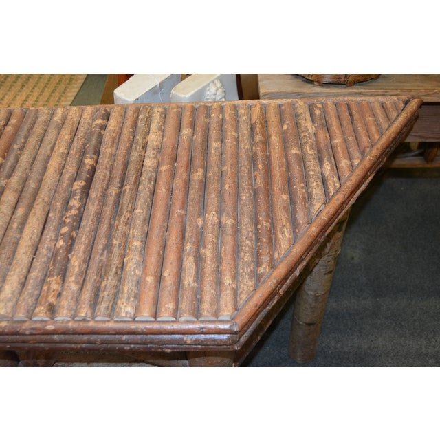 This is a solid/sturdy hand crafted table. All log wood, heavy. No labels etc.