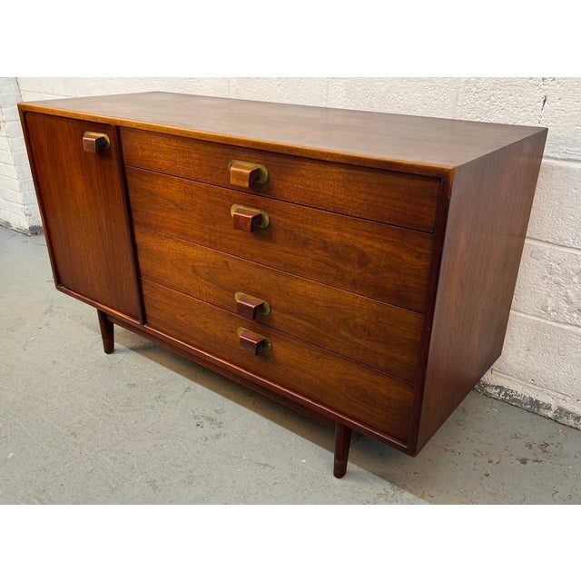 A refined example of mid-century modern design by acclaimed designer Jens Risom, this walnut sideboard dates to the...