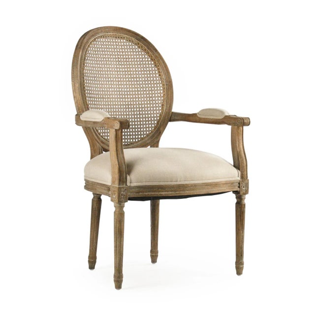 Round back arm chair upholstered in natural linen on limed grey oak frame.