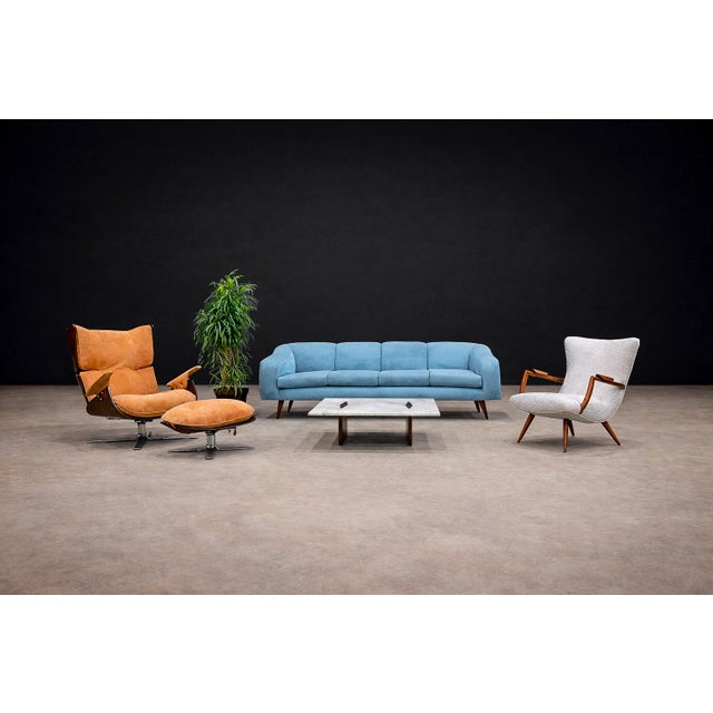 Crafted in solid caviúna hardwood, this lounge chair reflects the expressive warmth and sculptural sensibility associated...