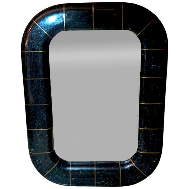 An Art Deco inspired jet black tessellated marble stonewall mirror with spokes of inlaid brass. The mirror has a 1" bevel...