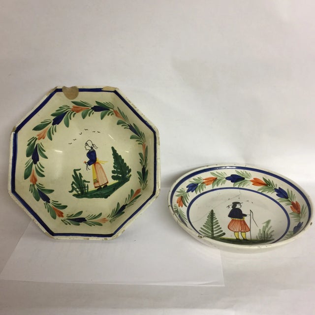 These are two charming antique French Quimper ceramic hand painted bowls in well loved condition. Each has some cracks and...