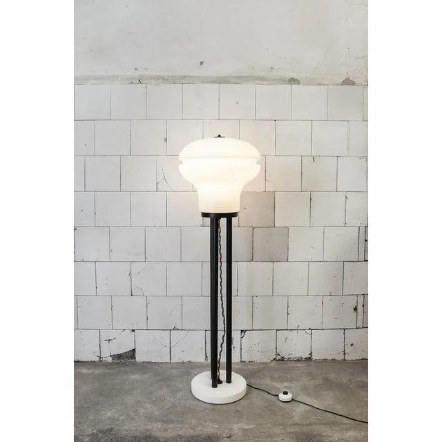 Earth lamp with iron structure, glass lampshade and marble base. Italian production 70's European Plug (up to 250V).The...