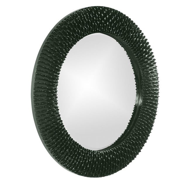 Bergman features a round frame characterized by a textured ribbed frame. It is then painted with our custom glossy hunter...