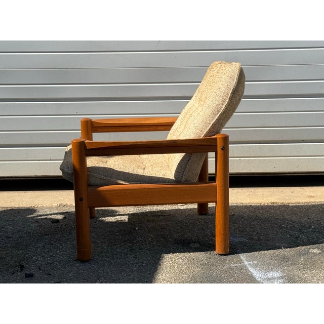 Mid-Century Danish Modern Domino Mobler Tufted Teak Lounge Chair Offered is a Danish modern teak lounge chair made by...