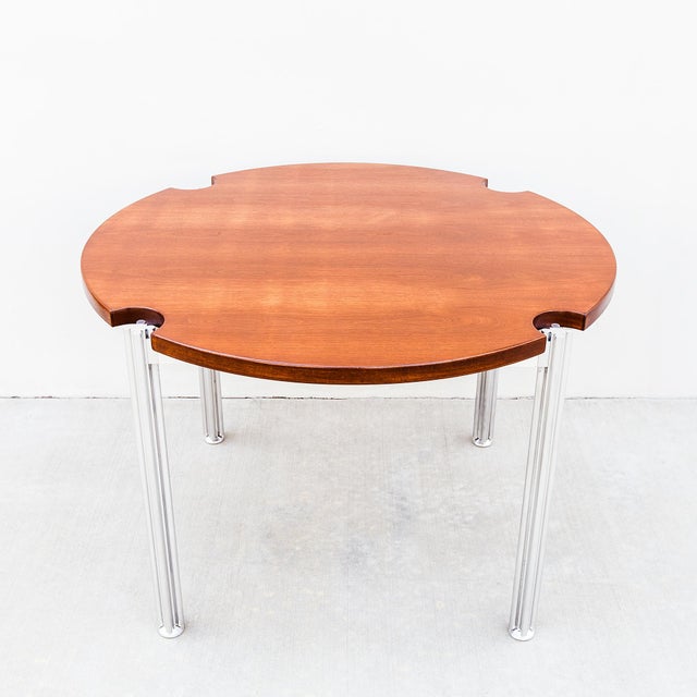 Walnut and stainless steel dining table by London-based furniture designer George Ciancimino for Risom Design Inc, made in...