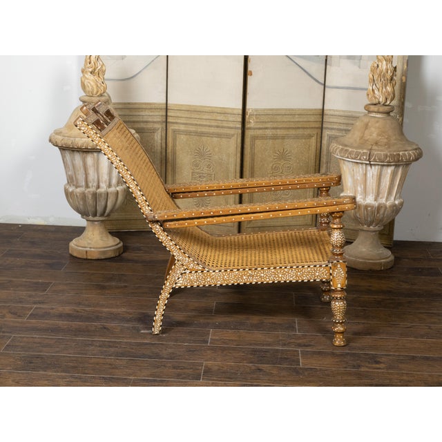 Wood Early 20th Century Anglo-Indian Inlaid Plantation Chair with Scrolling Foliage and Extending Arms For Sale - Image 7 of 12