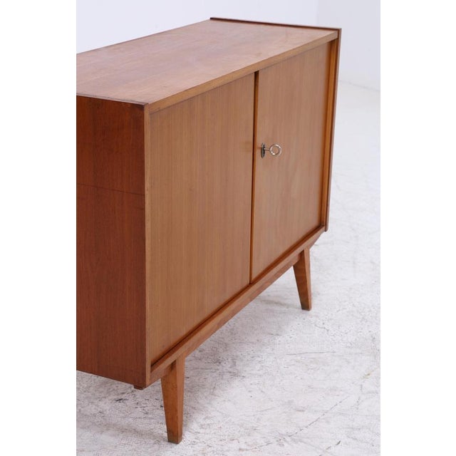 A beautiful vintage chest of drawers from the 60s with a clean, compact design and a calm wood finish. A simple piece that...