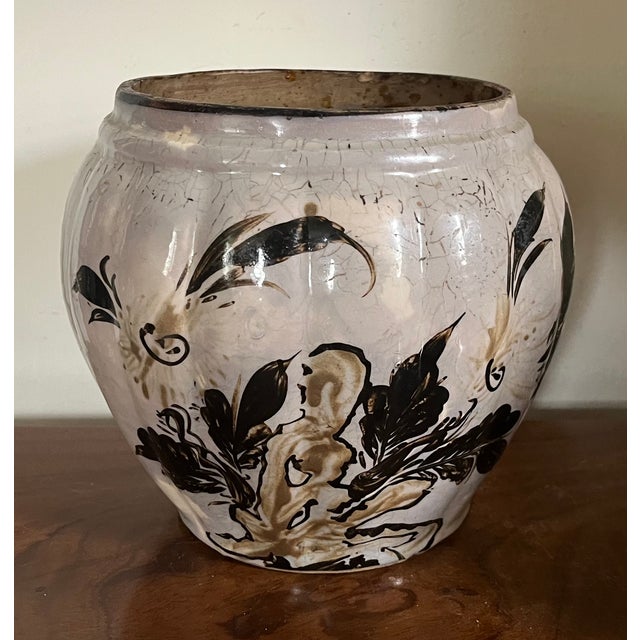 Antique 18th century Chinese pottery melon shaped vase or jar decorated with rock work and foliage on a gray ground. Vase...