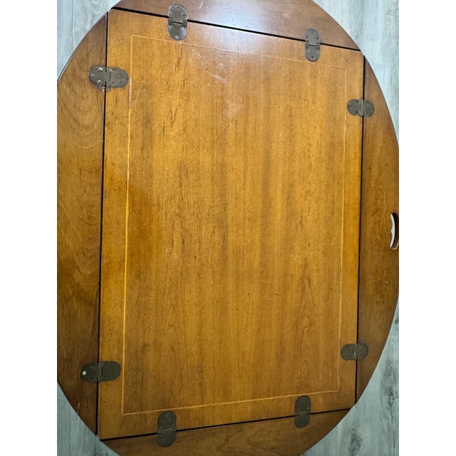 An exceptional mid-century modern oval coffee table manufactured by Drexel Heritage, beautifully combining organic forms...