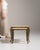 Brass-legged nesting console table in Antique Brass. Finished in antique brass, this brass-legged nesting console table is...