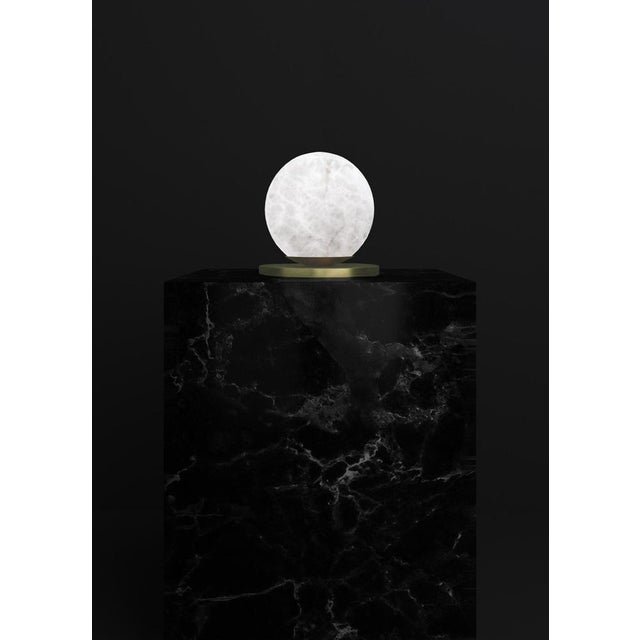 Ofione brushed brass table lamp by alabastro italiano dimensions: d 16 x w 16 x h 16 cm. Materials: white alabaster and...