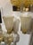 The product is a pair of Murano gold vase form sconces. These fixtures are crafted with a unique Murano glass design and a...