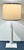 Stylish Modern Tapered Organic Fluted Matte White Table Lamp, light camel fabric shade, showroom floor sample