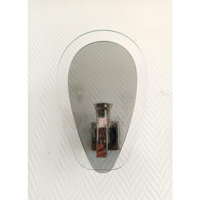 Pair of Space Age wall sconces, circa 1970 These sconces are composed of two palm fronds: one larger one in thick clear...