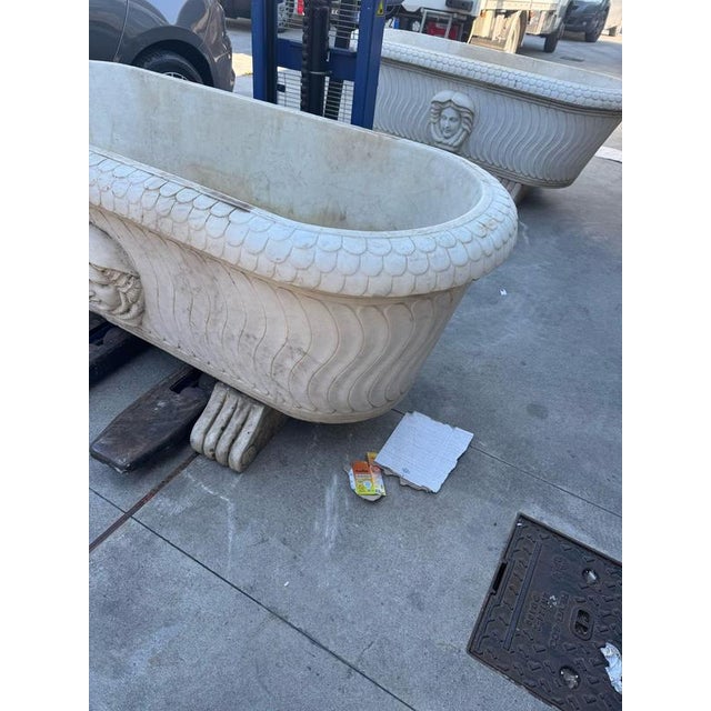 Elegant pair of classic freestanding bathtubs, crafted from high-quality white marble, showcasing timeless Italian...
