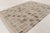 This handwoven wool 9x12 Scandinavian rug features a geometric grid of tonal squares in soft beige, taupe, ivory, and...