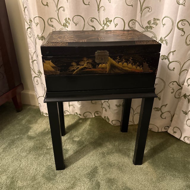 A wonderful mid to late 19th century Shenwari riding box or lap desk on stand. Black lacquer with gold guilt raised...